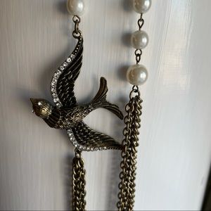 Long chain necklace with faux pearls & bird charm